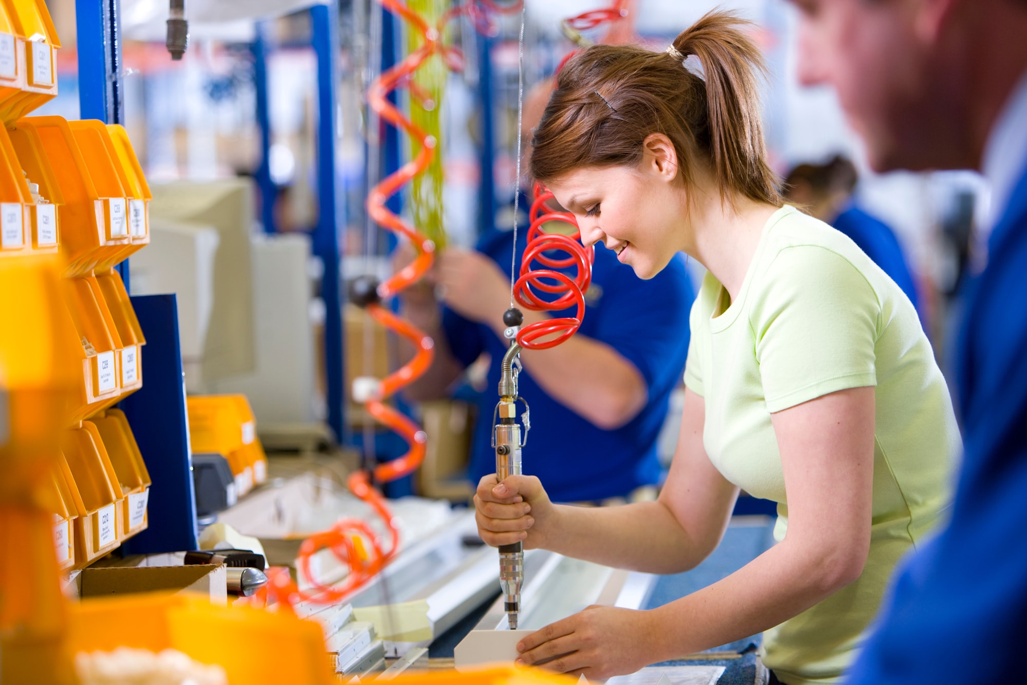 Factory worker at an added value station