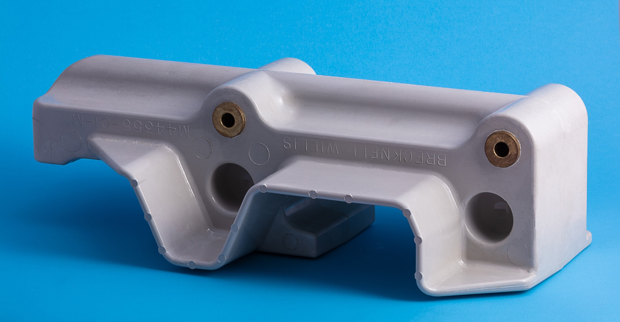 Composite moulded rail insulator