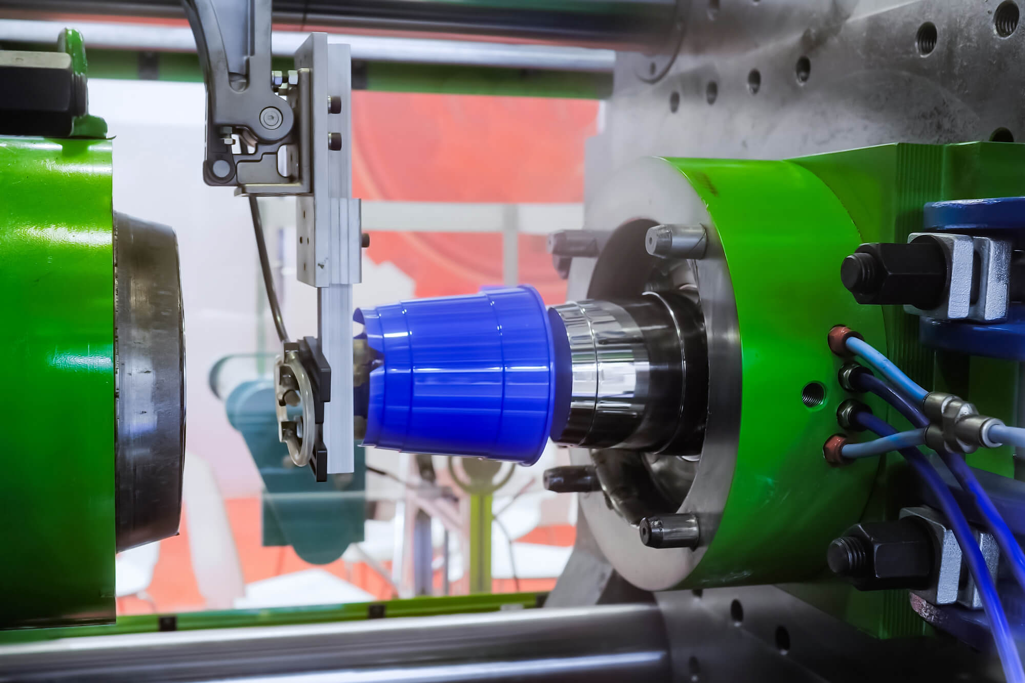 Blue Injection Moulded plastic product in machine